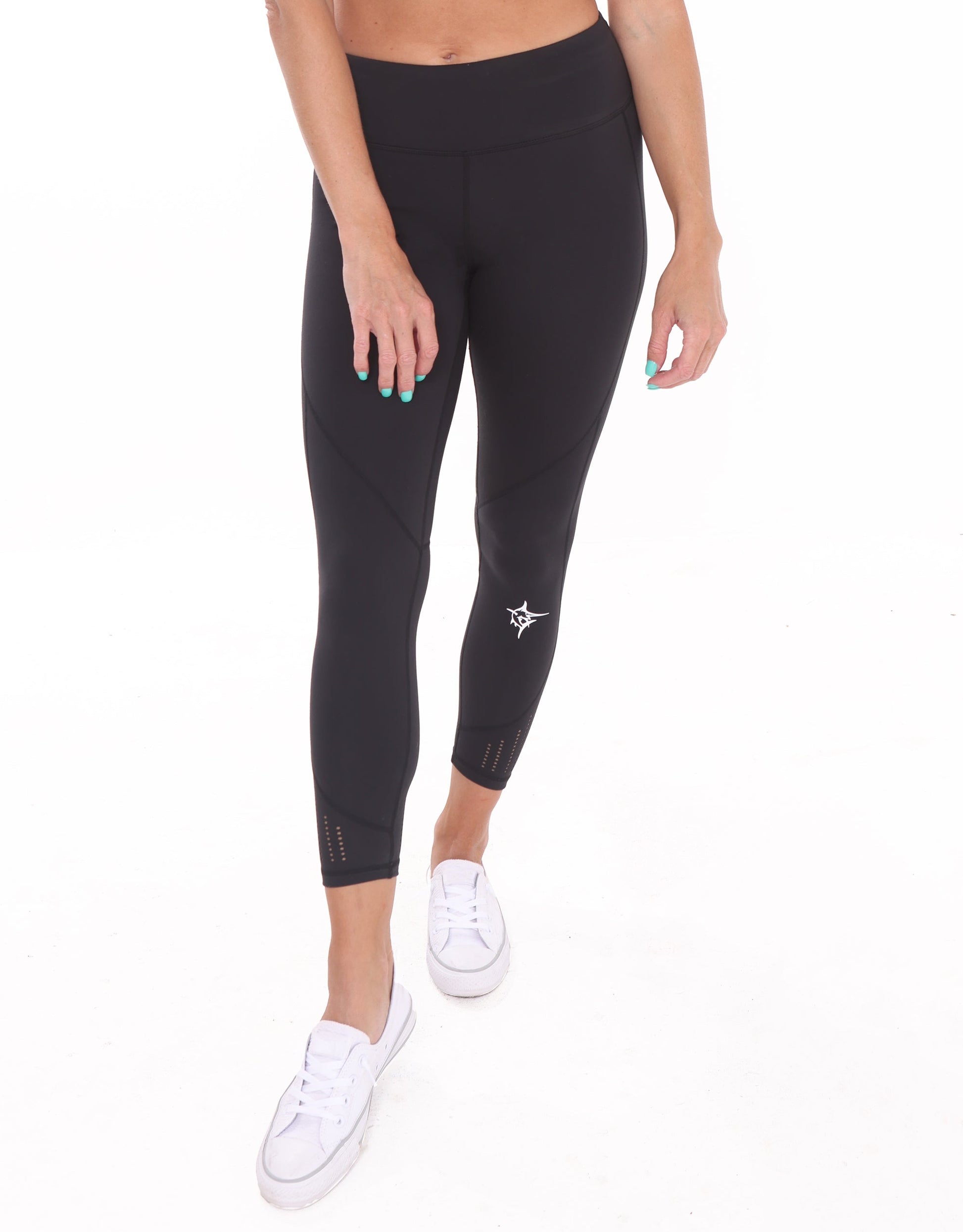 Black HydroFlex cut-out leggings by White Water Life, showcasing their sleek design and flexible fabric for active wear.