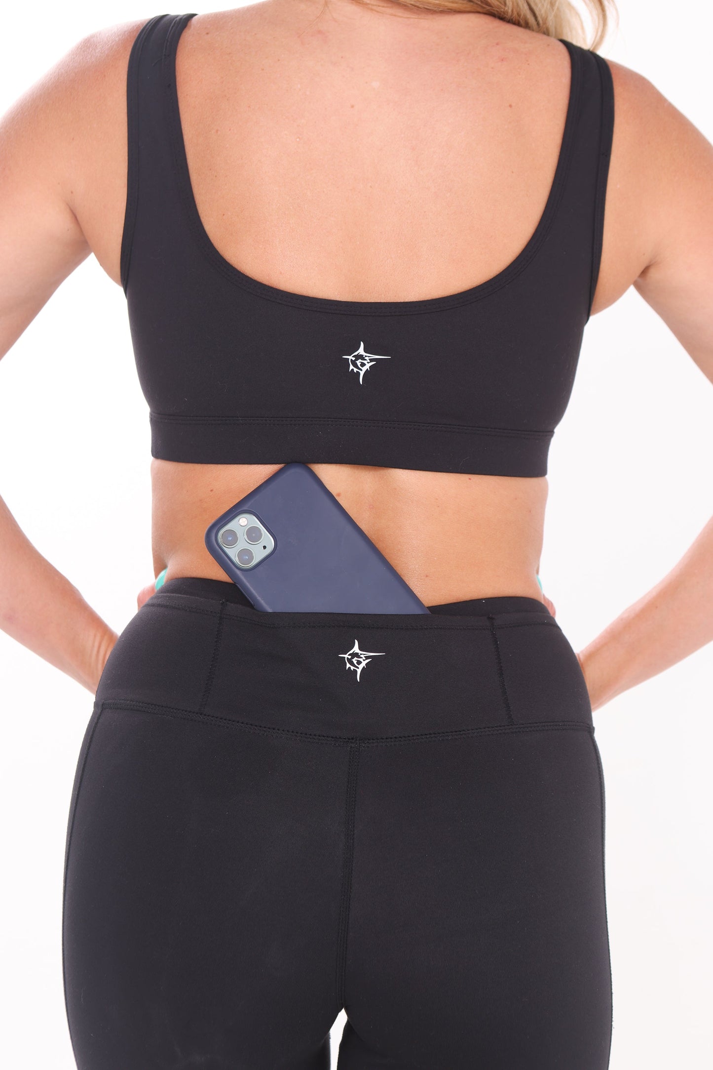 Black HydroFlex Cut Out Leggings by White Water Life, featuring breathable fabric and stylish cut-out design for active wear.