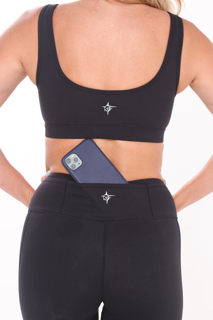 Black HydroFlex Cut Out Leggings by White Water Life, featuring breathable fabric and stylish cut-out design for active wear.