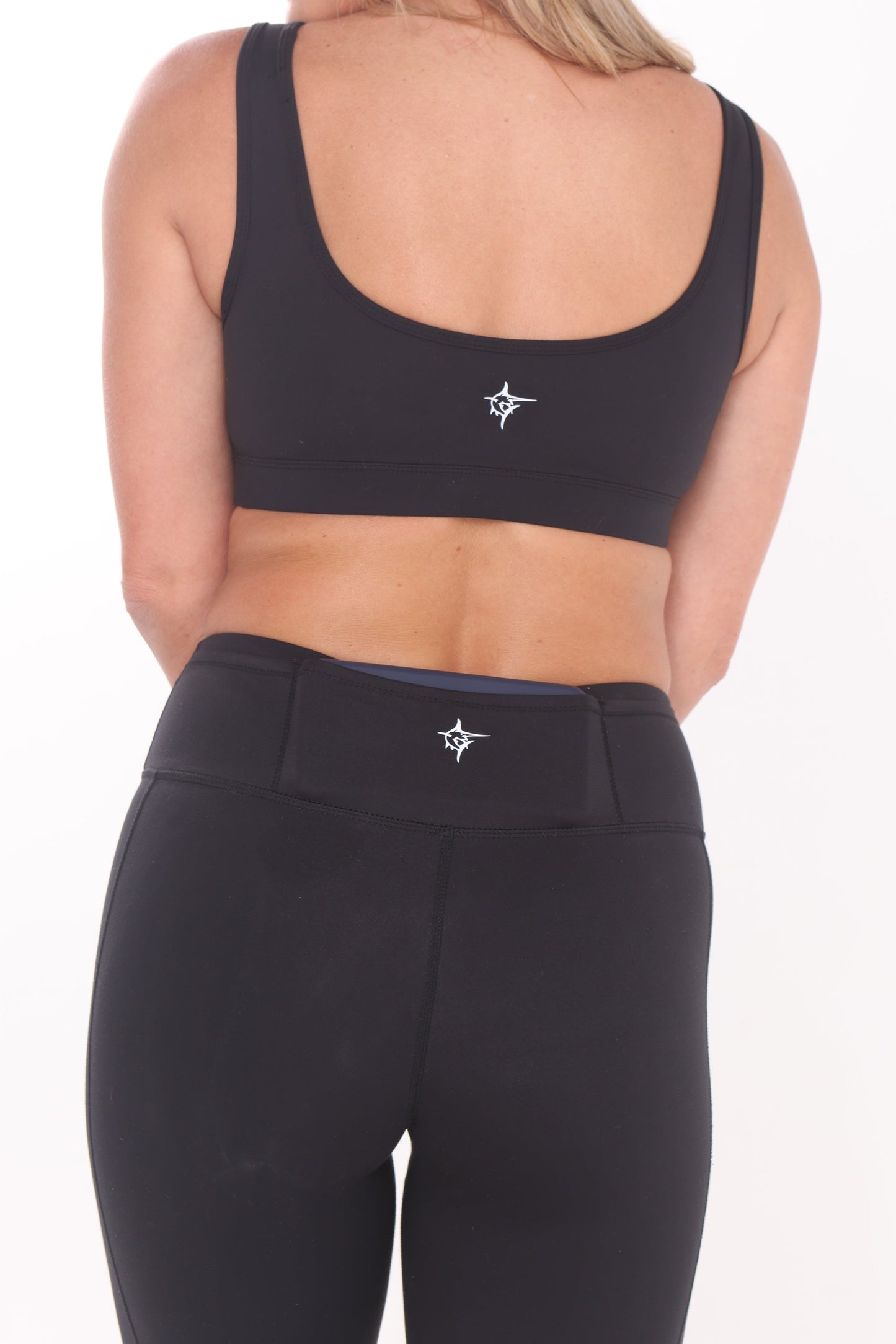 Black HydroFlex Cut Out Leggings by White Water Life, showcasing stylish design and comfortable fit for active wear.