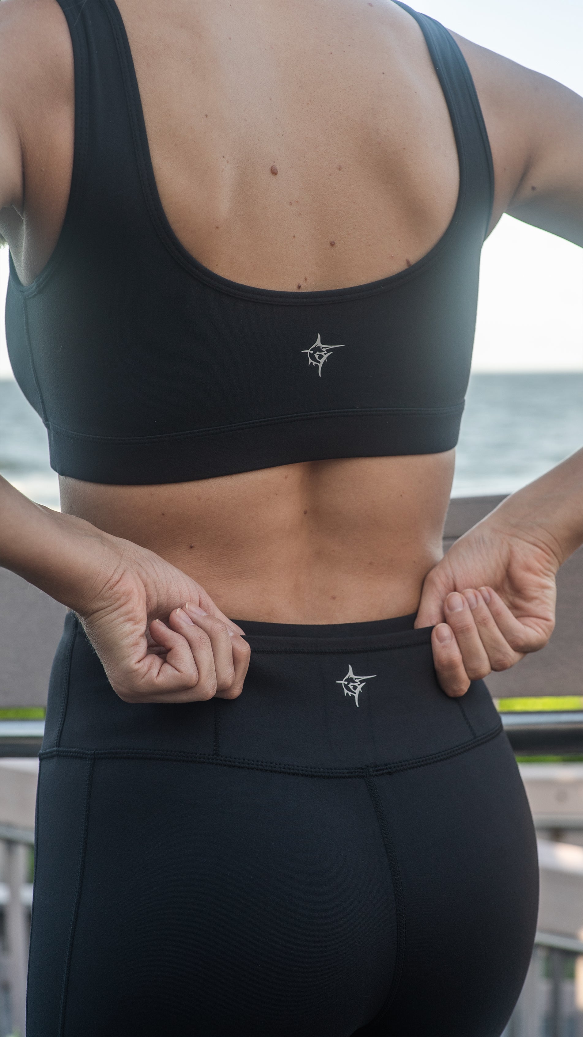 White Water Life HydroFlex Cut Out Leggings shown in black with mesh cutouts and stretchy fabric for active wear.