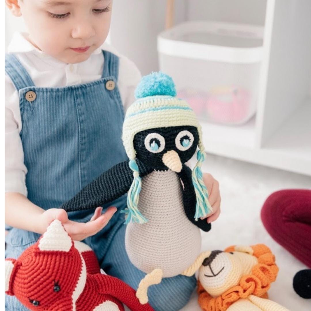 Handmade Willy the penguin stuffed animal made from organic cotton by Bebemoss, soft and cuddly penguin toy for children.