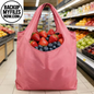Ten pink reusable grocery bags from Wudkey with storage pouches and elastic bands for shopping and eco-friendly carrying.