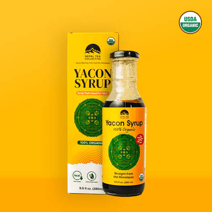 Organic Yacon Syrup bottle from Nepal Tea, showing the clear, dark syrup in a glass jar with a white label and natural packaging.