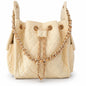 Small Bayshore Bucket Bag in Butter Yellow by BEACH HAUS, featuring a woven texture and adjustable strap.