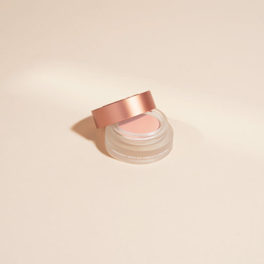 YENSA Super Bright Dark Circle Serum Eye Corrector in fair shade, featuring a sleek tube with applicator tip for brightening and peptide correction.