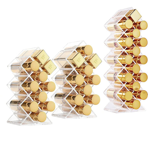 Acrylic 16-grid makeup organizer with lipstick and jewelry storage, holding makeup brushes and lipstick tubes.