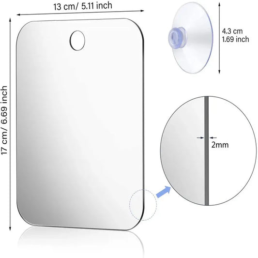Acrylic wall-mounted shower mirror with suction cup, compact and portable for shaving, makeup, and bathroom use.