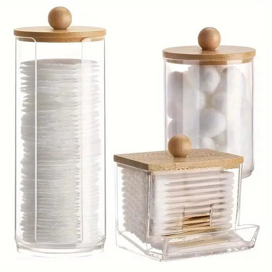 Your Skin Icon bathroom organizer set with clear lids, cotton swab dispenser, and storage jars for makeup and bathroom essentials.